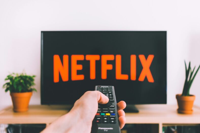 A man turning on Netflix